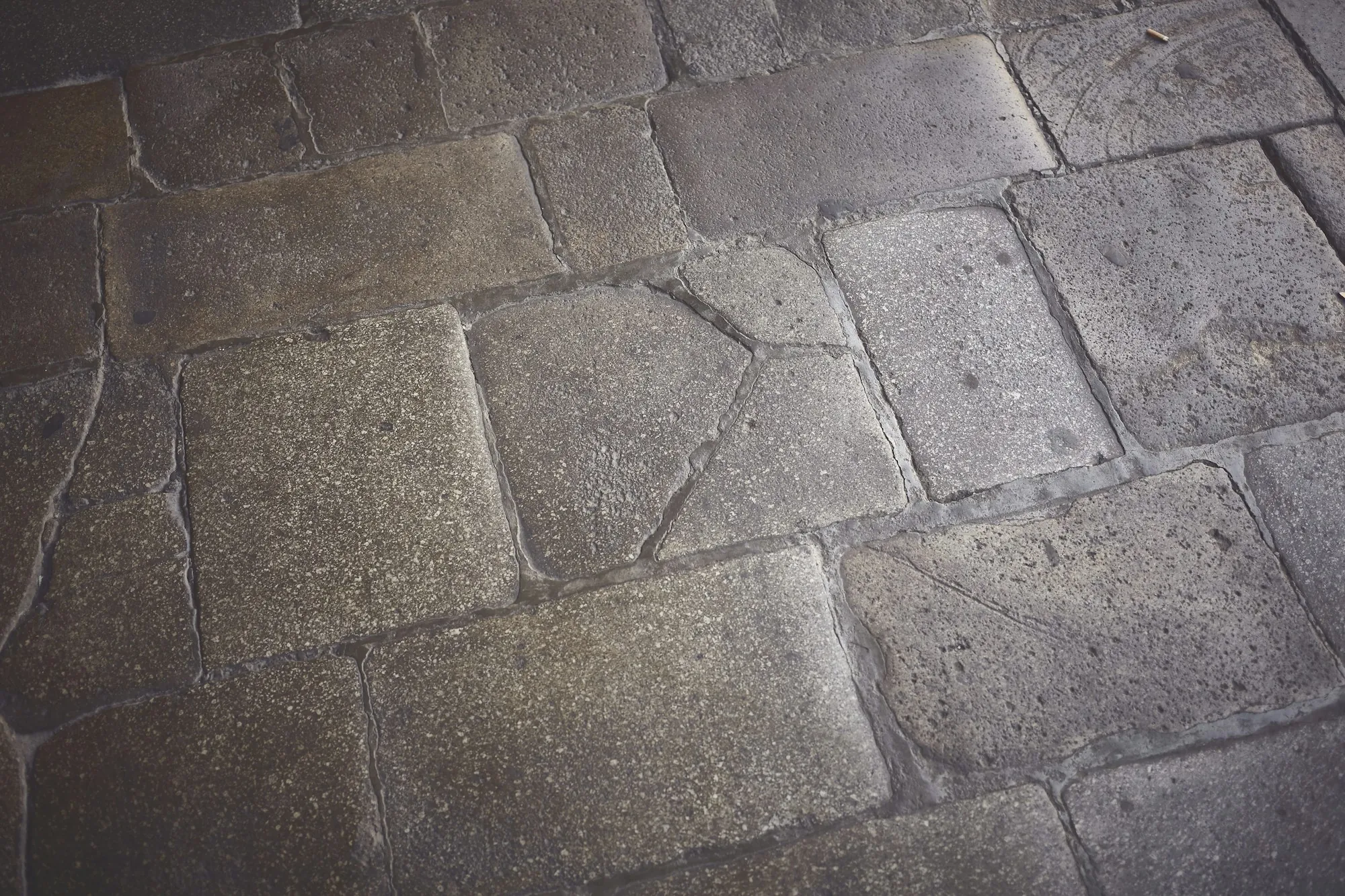 Gray-brown stamped concrete with a slate tile texture